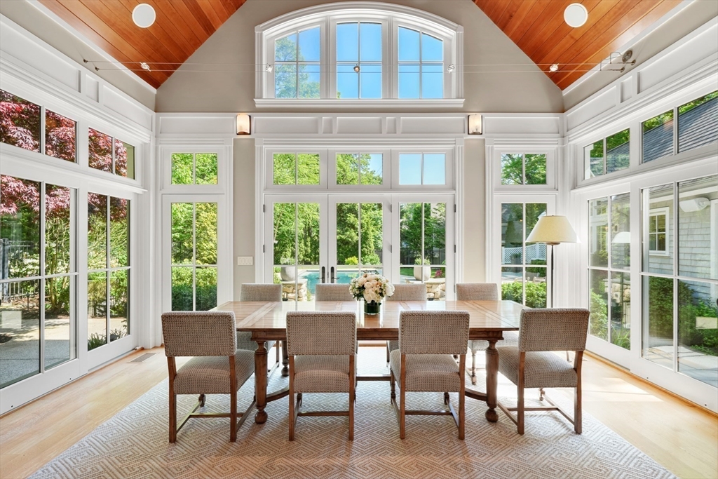 70 Old Farm Road Wellesley, MA 02481 - Photo 9 of 38 a view of a dining room with furniture large windows and wooden floor