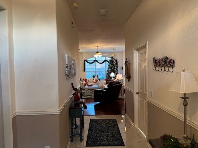 9918 Mossy Tree Lane Houston, TX 77064 - Photo 2 of 15 a view of a hallway to a livingroom with furniture