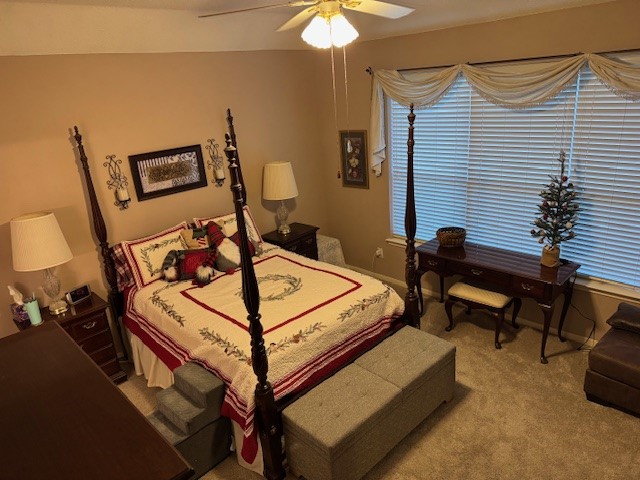 9918 Mossy Tree Lane Houston, TX 77064 - Photo 9 of 15 a bedroom with furniture and a lamp