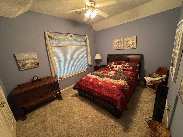 9918 Mossy Tree Lane Houston, TX 77064 - Photo 10 of 15 a bedroom with a bed and window