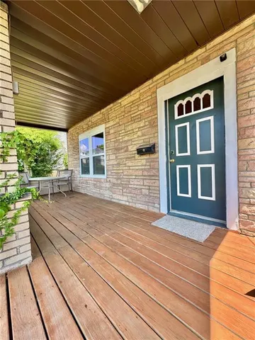 a balcony view with a seating space