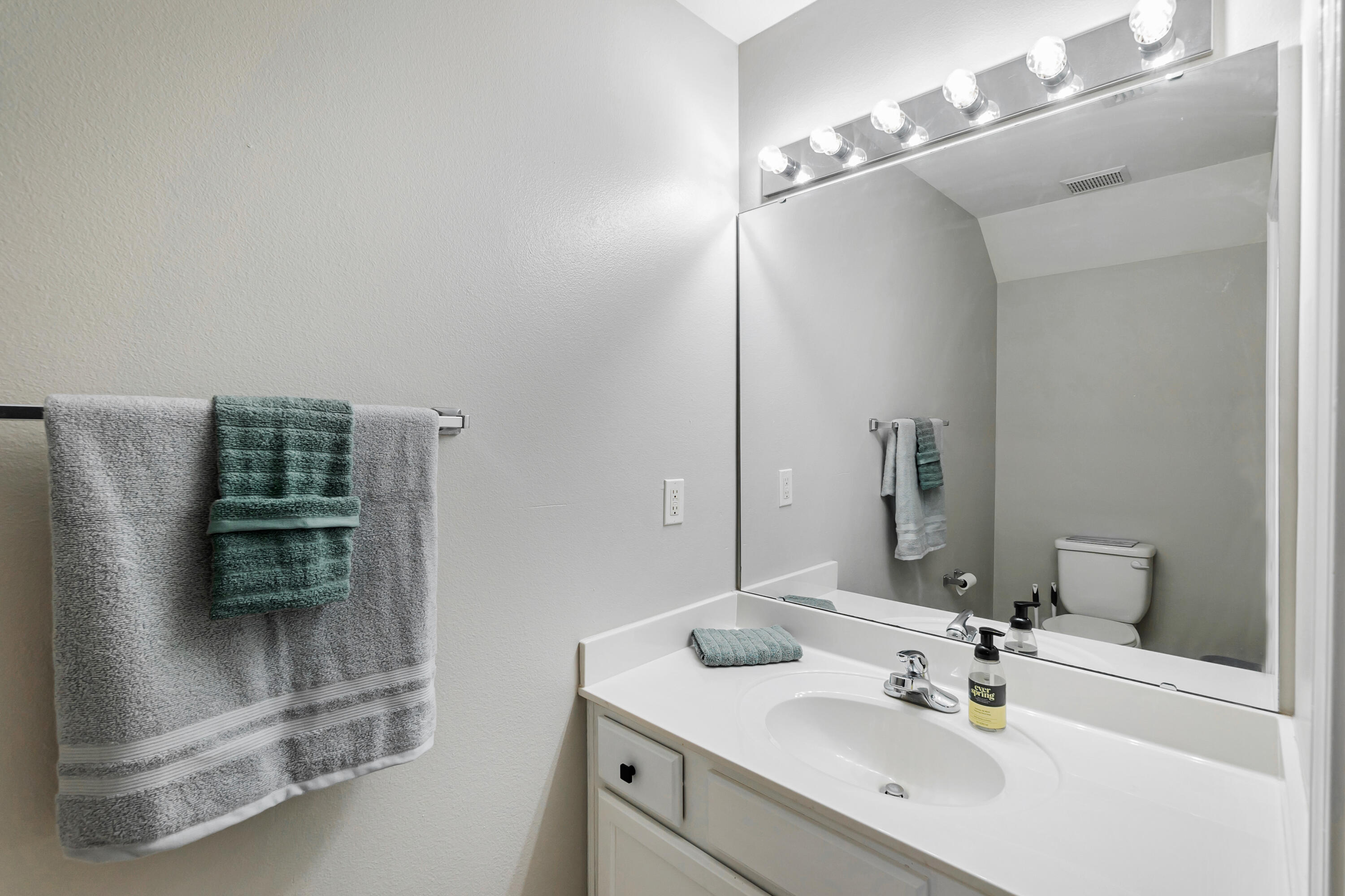 17 Southeast Shell Avenue, Unit C1 Fort Walton Beach, FL 32548 - Photo 11 of 24 a bathroom with a sink and a mirror