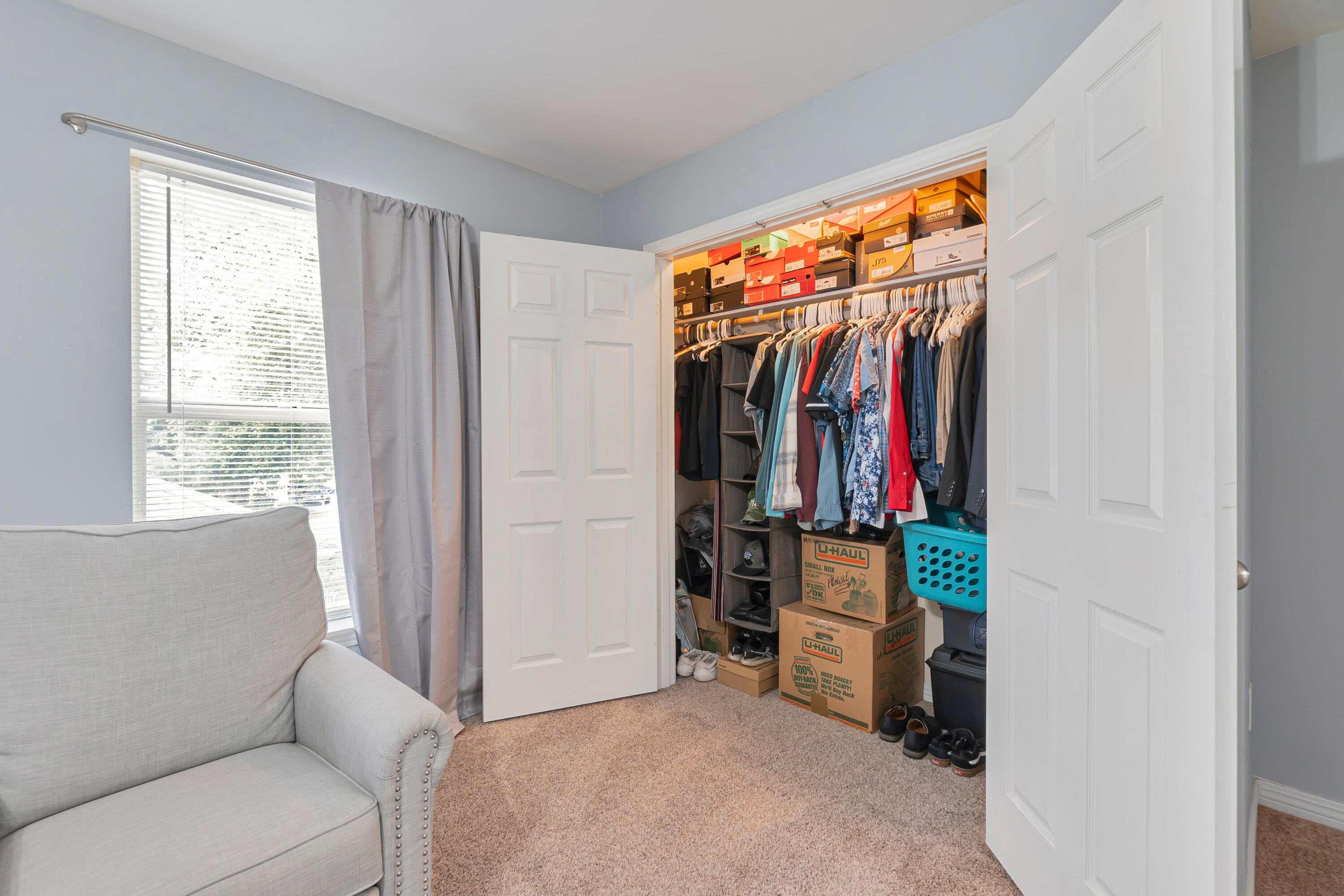 17 Southeast Shell Avenue, Unit C1 Fort Walton Beach, FL 32548 - Photo 16 of 24 a view of walk in closet with clothes and shoes