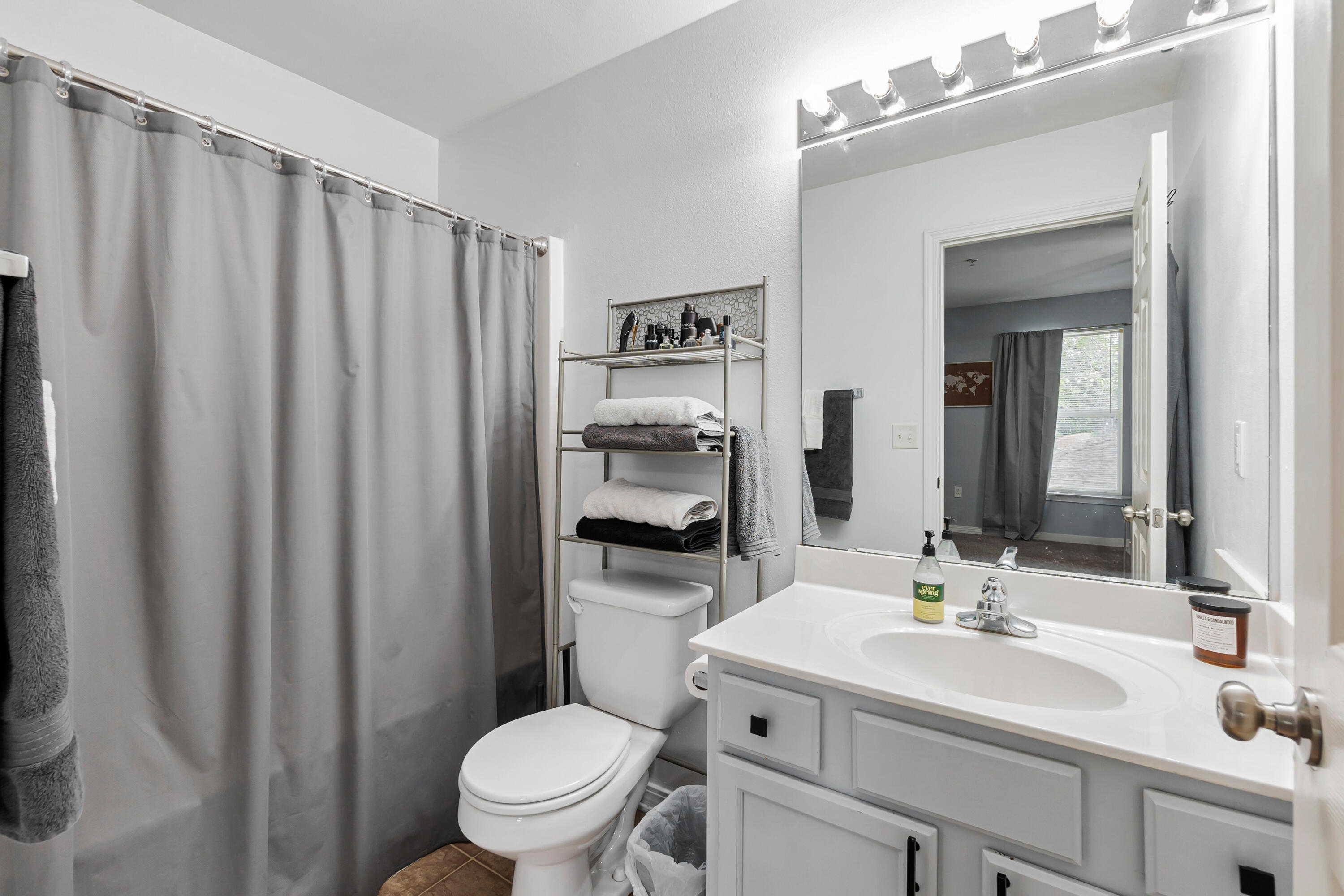 17 Southeast Shell Avenue, Unit C1 Fort Walton Beach, FL 32548 - Photo 17 of 24 a bathroom with a sink a toilet and shower