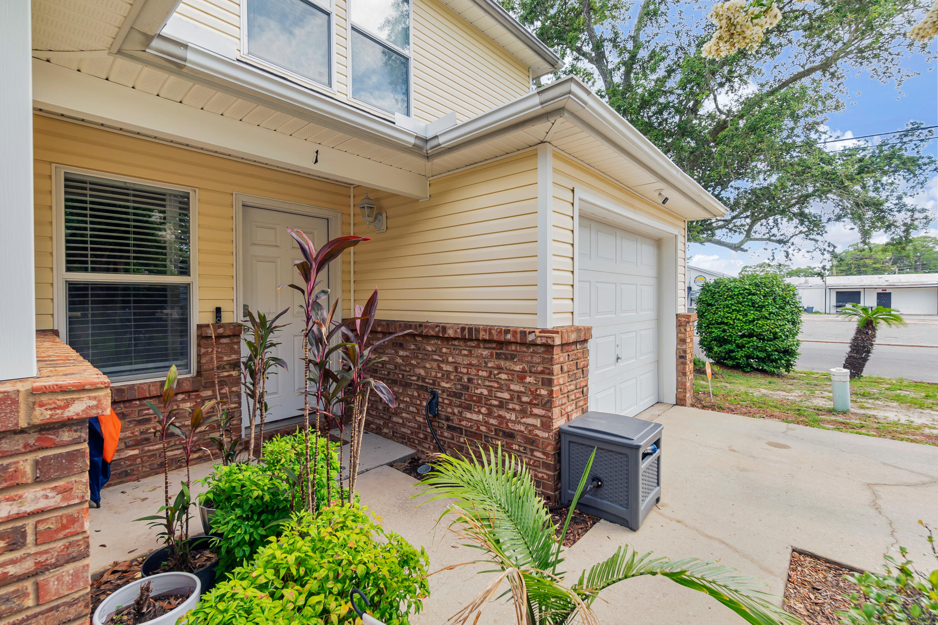 17 Southeast Shell Avenue, Unit C1 Fort Walton Beach, FL 32548 - Photo 2 of 24 a view of backyard with plants and outdoor seating