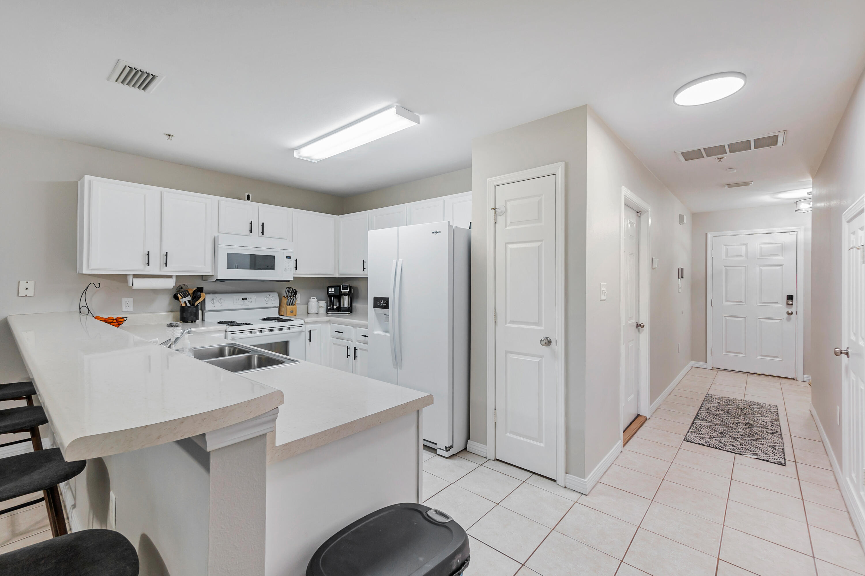 17 Southeast Shell Avenue, Unit C1 Fort Walton Beach, FL 32548 - Photo 8 of 24 a kitchen with stainless steel appliances a refrigerator sink and cabinets