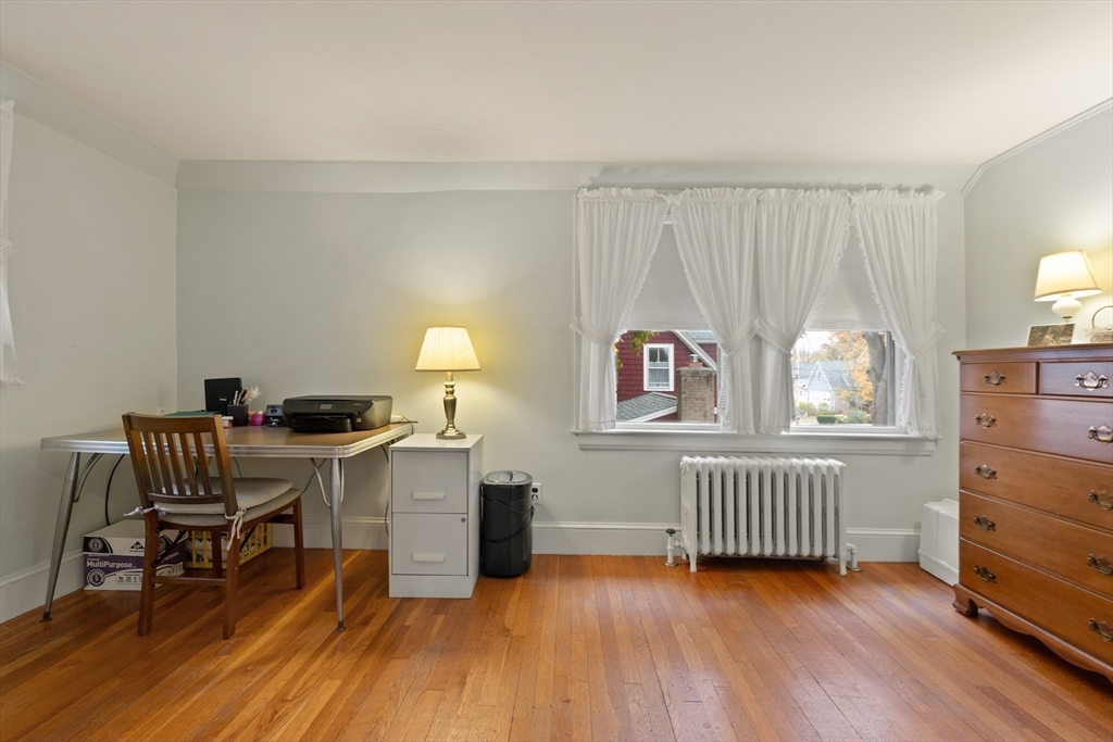 103 Madison Street Dedham, MA 02026 - Photo 14 of 21 a room with furniture and a window