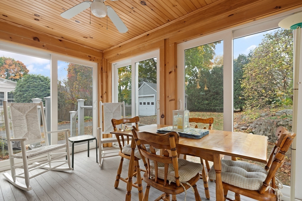 103 Madison Street Dedham, MA 02026 - Photo 15 of 21 a view of a dining room with furniture large windows and wooden floor