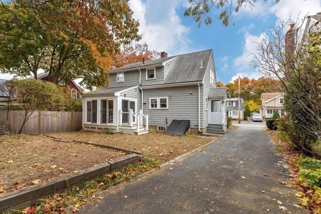 103 Madison Street Dedham, MA 02026 - Photo 18 of 21 a view of a house with a patio