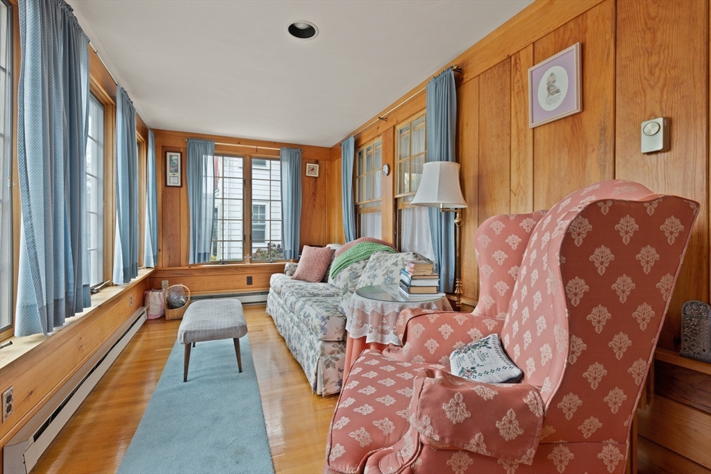 103 Madison Street Dedham, MA 02026 - Photo 3 of 21 a bedroom with furniture and large windows
