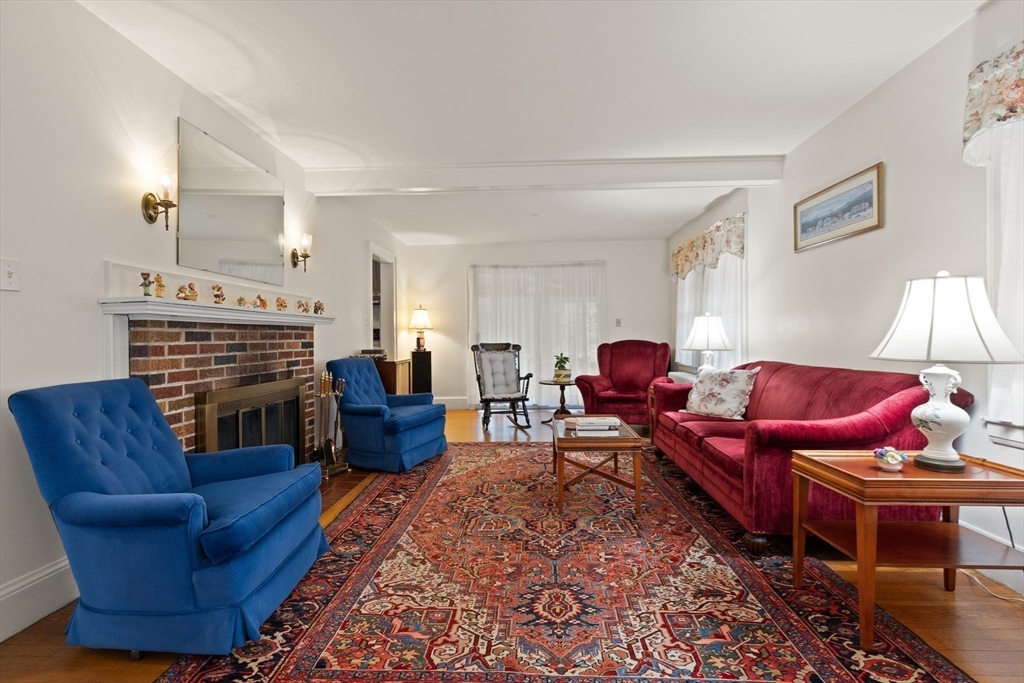 103 Madison Street Dedham, MA 02026 - Photo 4 of 21 a living room with furniture a couch and two windows