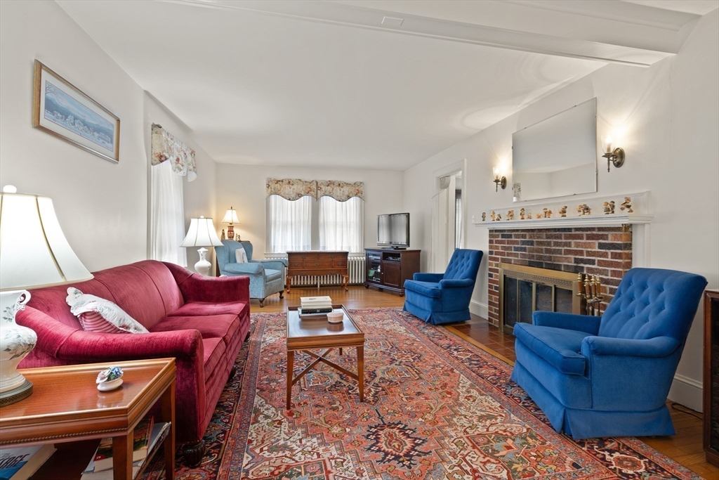 103 Madison Street Dedham, MA 02026 - Photo 5 of 21 a living room with furniture a rug and a window