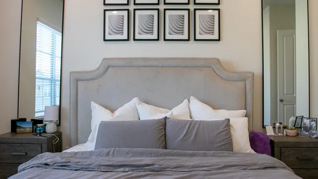 a view of a kitchen with kitchen island a sink stainless steel appliances and cabinets