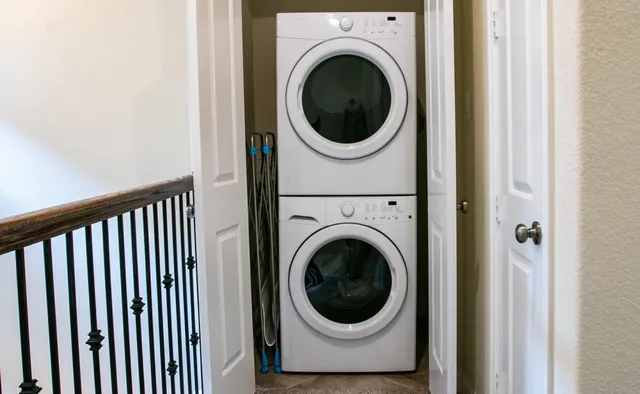 a view of a hallway with washer and dryer