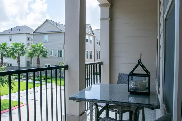 a view of a balcony dining area