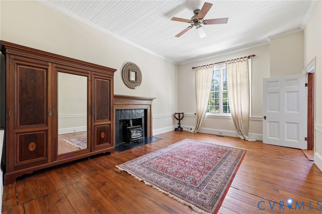 3355 Duke Road Powhatan, VA 23139 - Photo 24 of 67 a living room with furniture and a fireplace