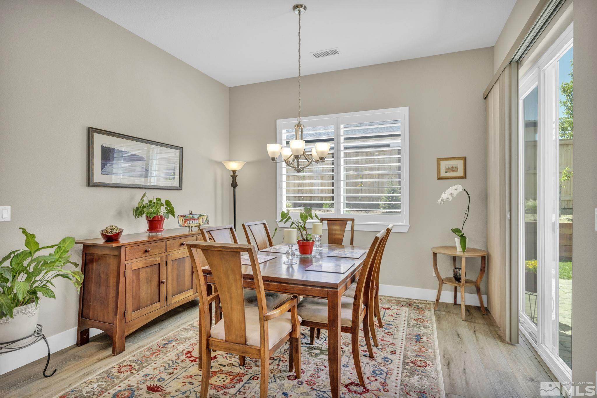615 Sage Grouse Loop Stateline, NV 89449 - Photo 12 of 40 a view of a dining room with furniture and window