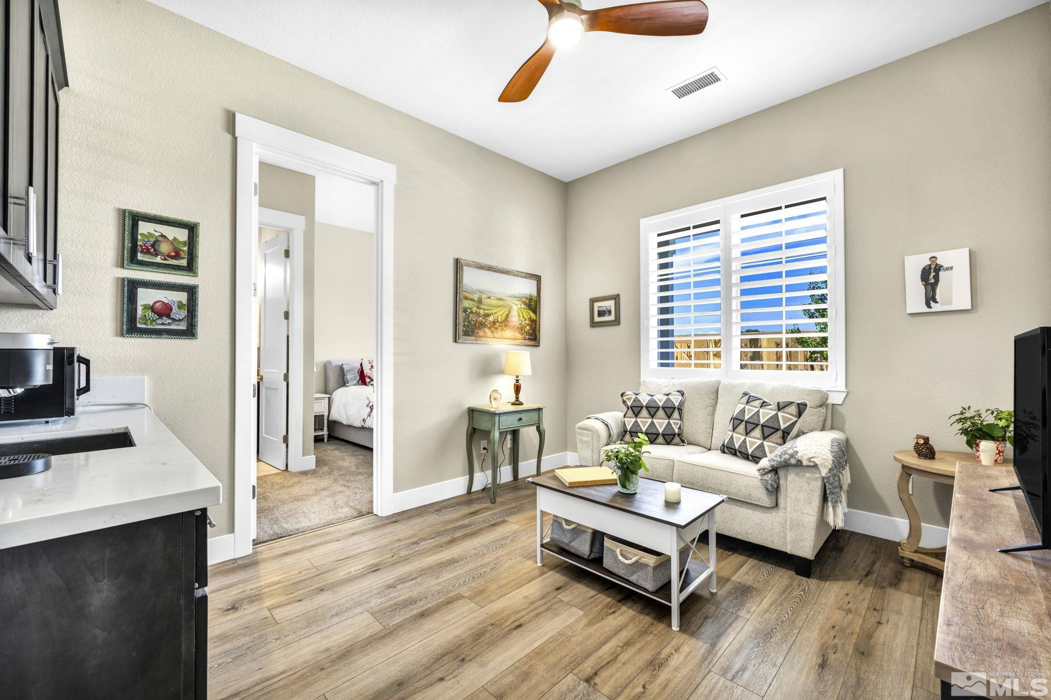 615 Sage Grouse Loop Stateline, NV 89449 - Photo 15 of 40 a living room with furniture and a wooden floor