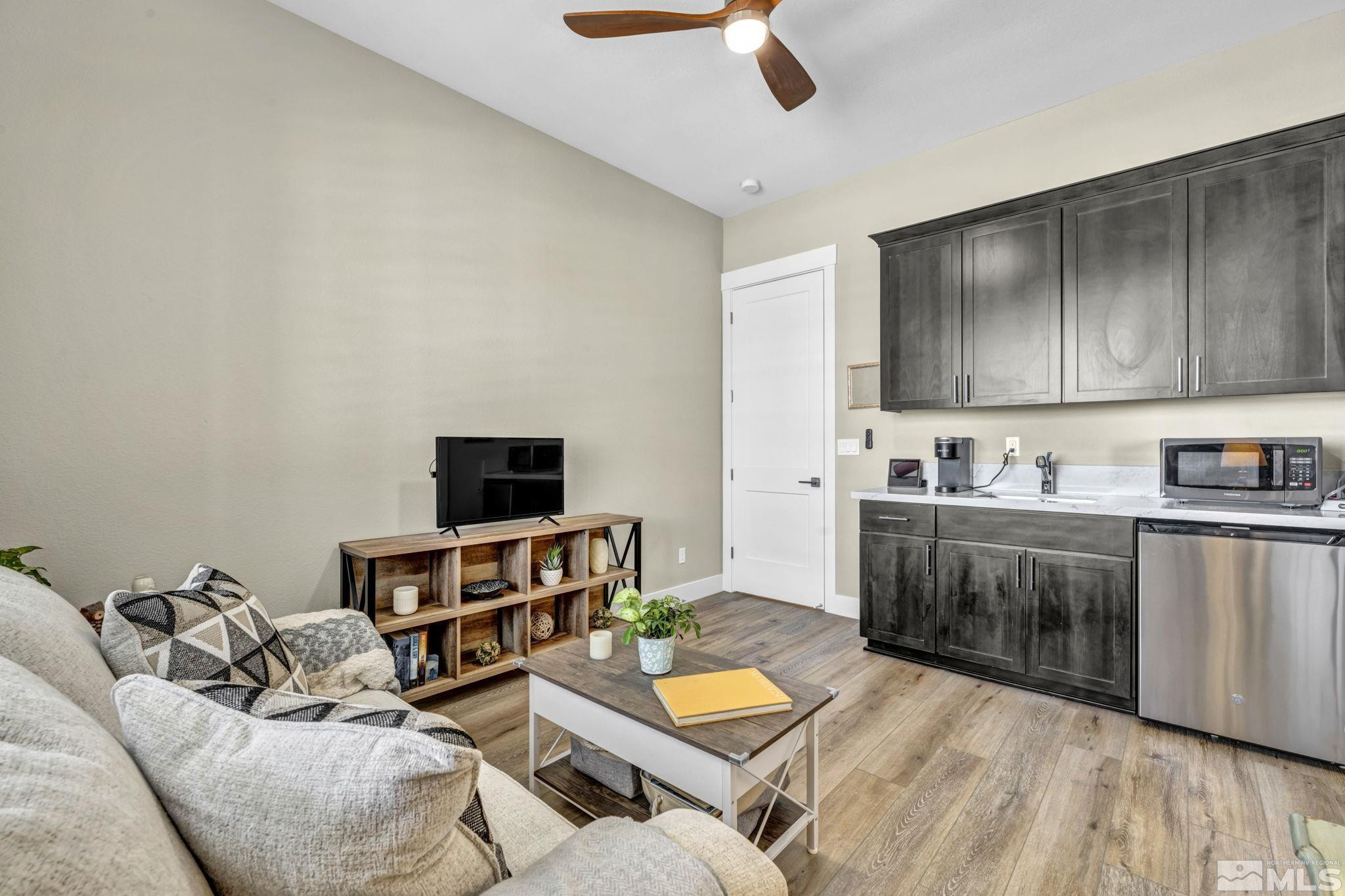 615 Sage Grouse Loop Stateline, NV 89449 - Photo 16 of 40 a living room with furniture and a wooden floor
