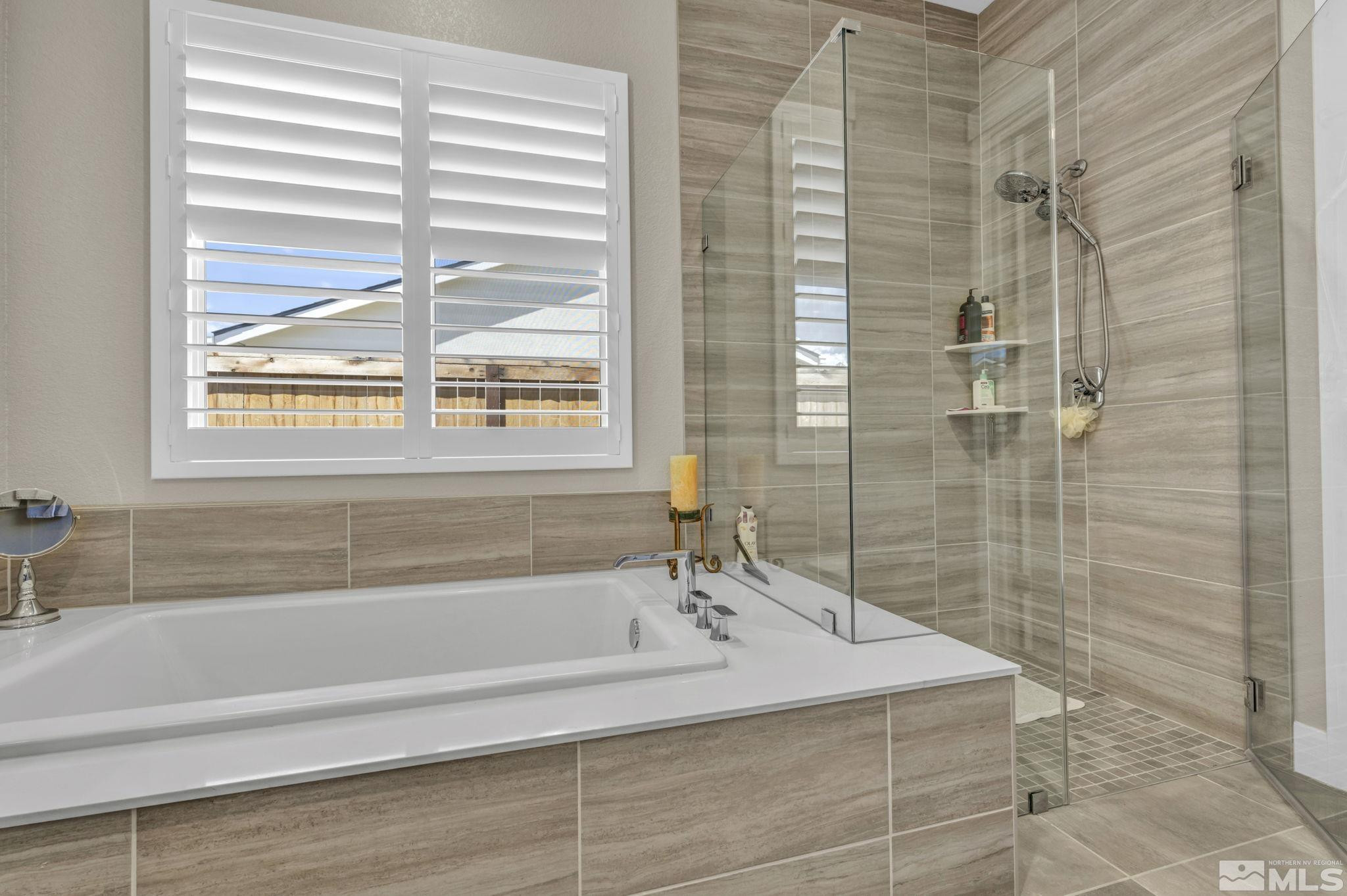 615 Sage Grouse Loop Stateline, NV 89449 - Photo 22 of 40 a bathroom with a bathtub and shower