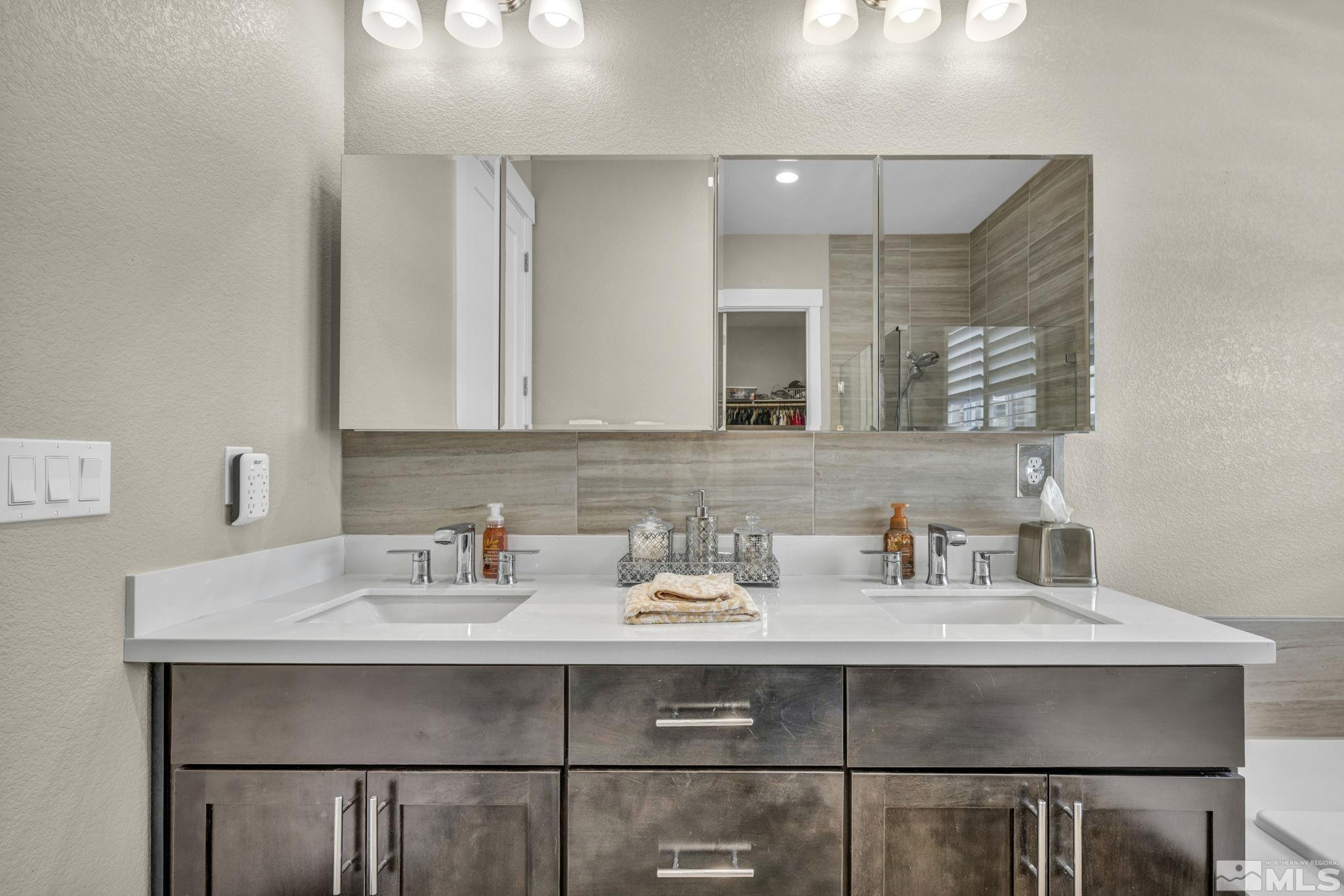 615 Sage Grouse Loop Stateline, NV 89449 - Photo 23 of 40 a bathroom with a sink and a mirror
