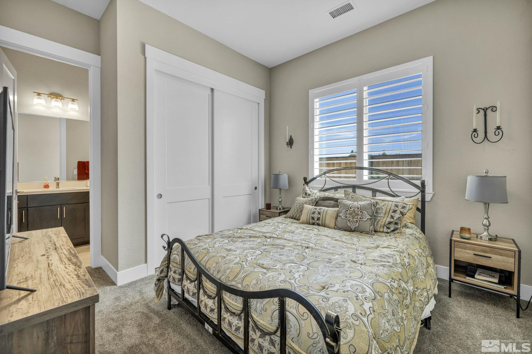 615 Sage Grouse Loop Stateline, NV 89449 - Photo 24 of 40 a bedroom with a bed and a couch