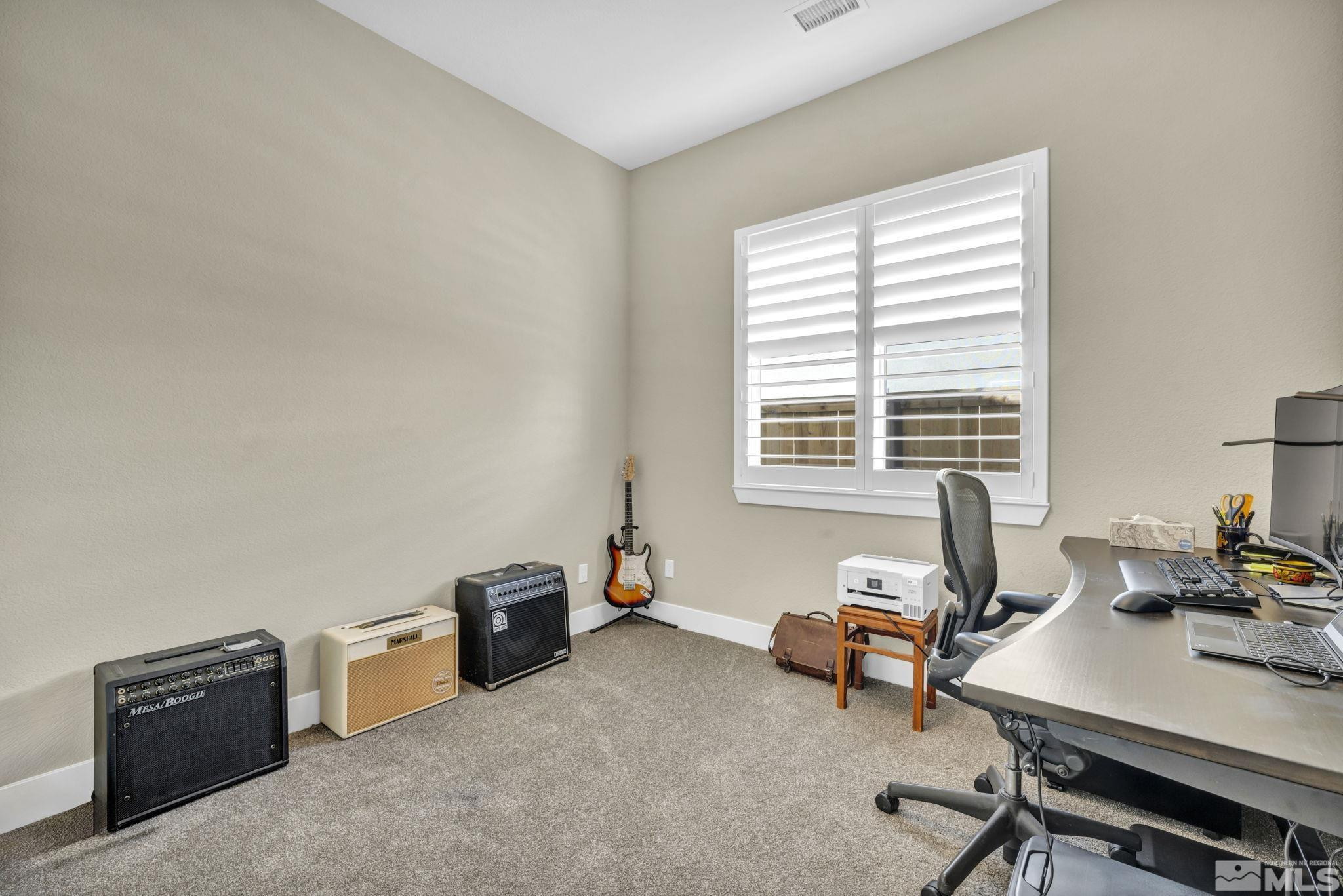 615 Sage Grouse Loop Stateline, NV 89449 - Photo 26 of 40 a livingroom with workspace and a window