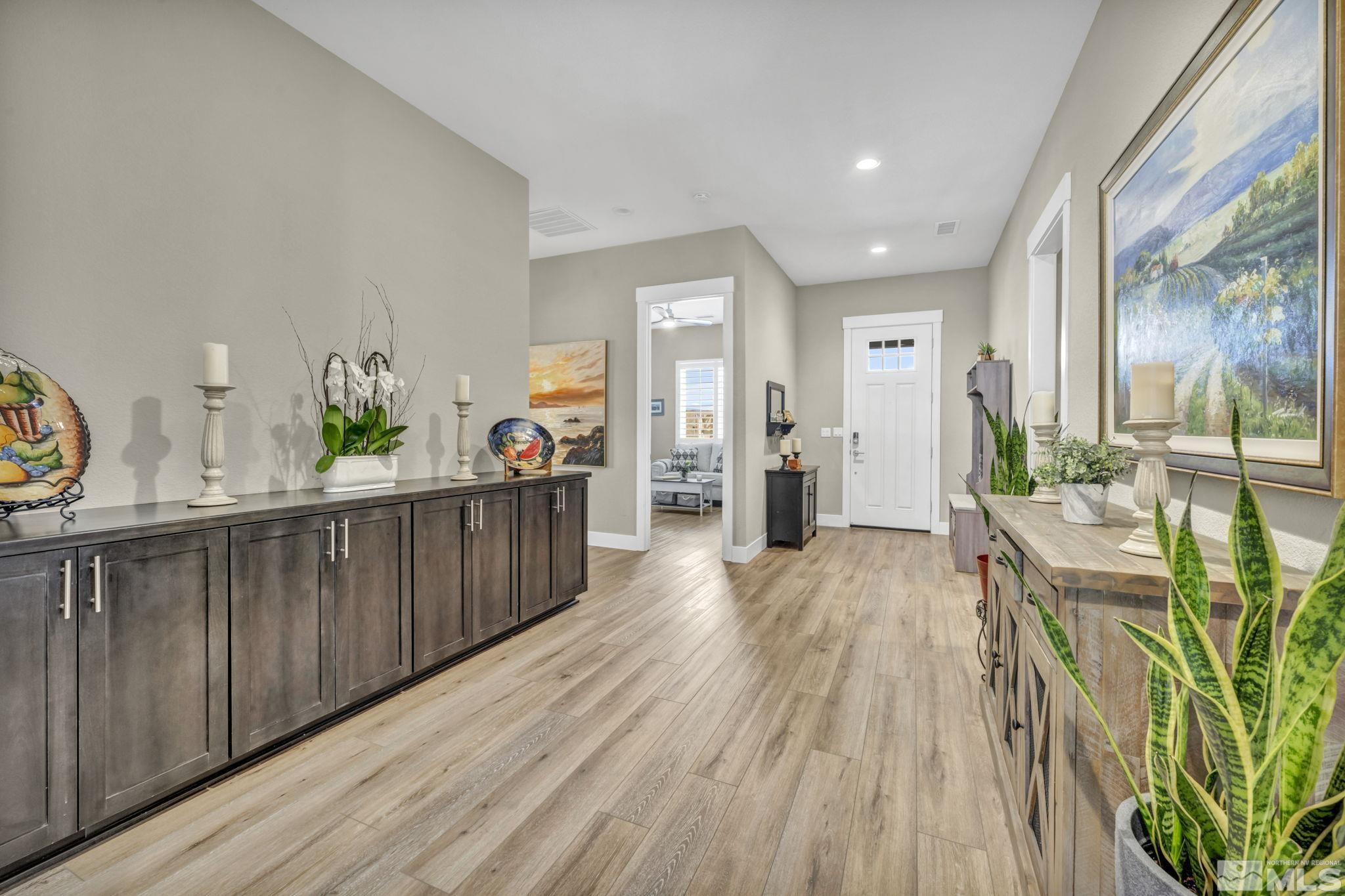 615 Sage Grouse Loop Stateline, NV 89449 - Photo 3 of 40 a view of a kitchen with furniture and wooden floor
