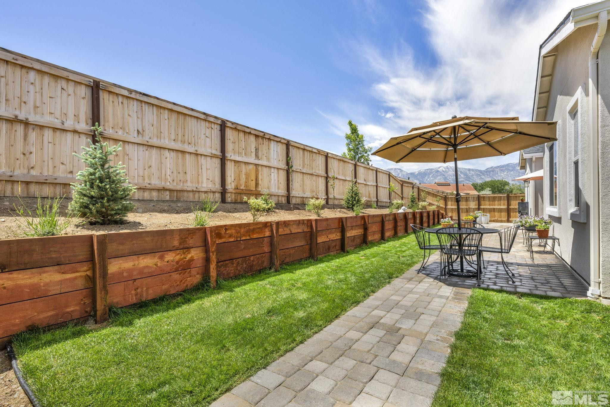 615 Sage Grouse Loop Stateline, NV 89449 - Photo 34 of 40 a view of a backyard with sitting area and furniture