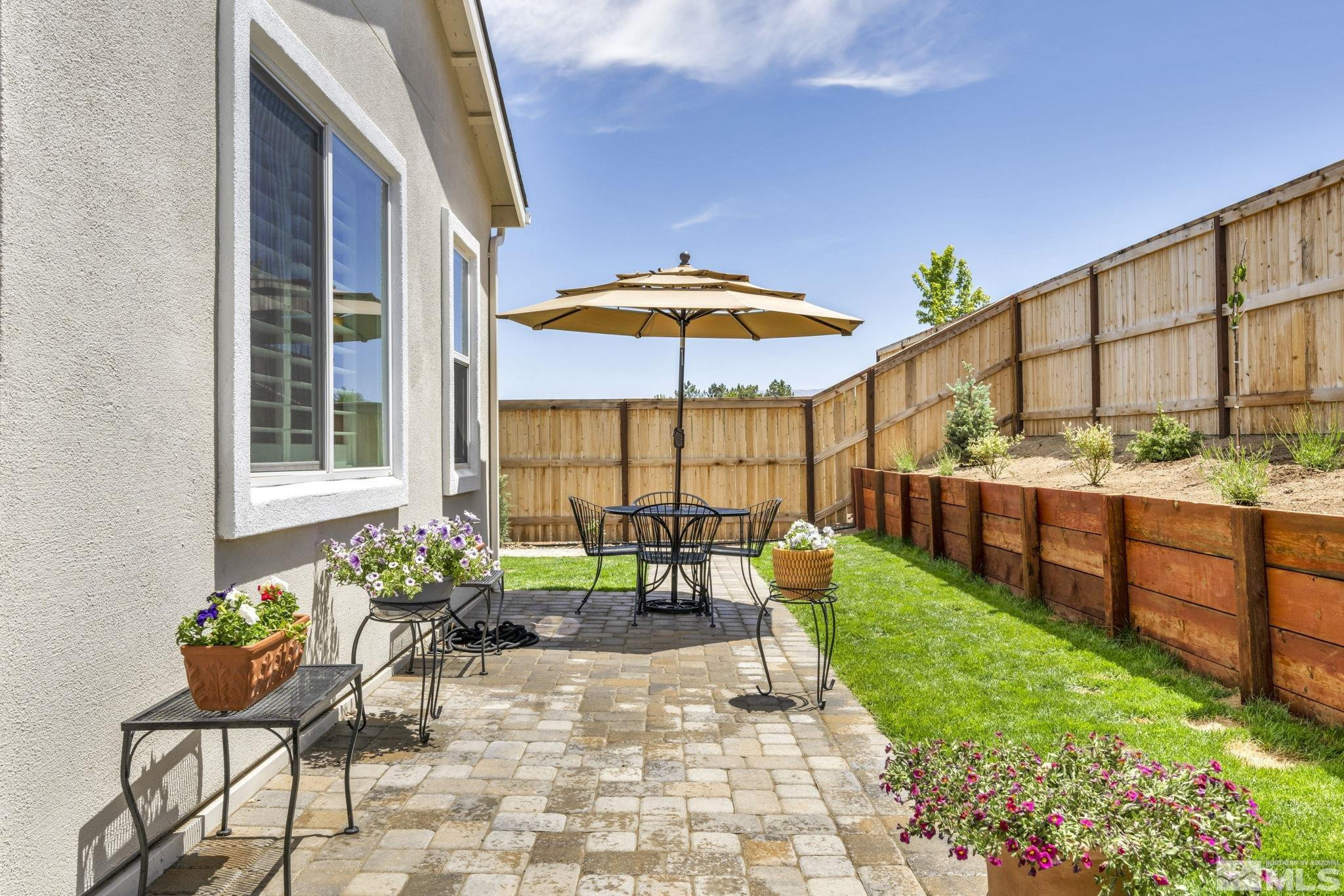 615 Sage Grouse Loop Stateline, NV 89449 - Photo 37 of 40 a view of a chairs and table in backyard