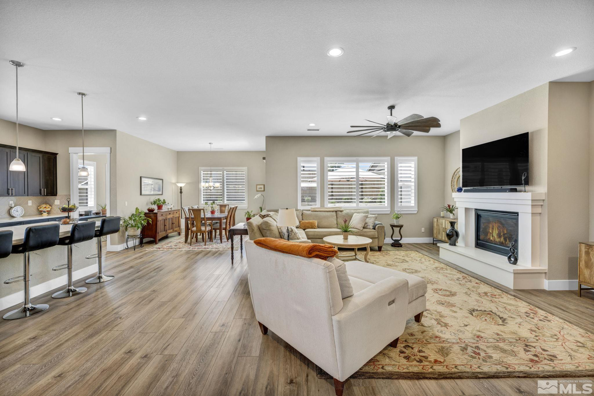 615 Sage Grouse Loop Stateline, NV 89449 - Photo 5 of 40 a living room with fireplace furniture and a flat screen tv