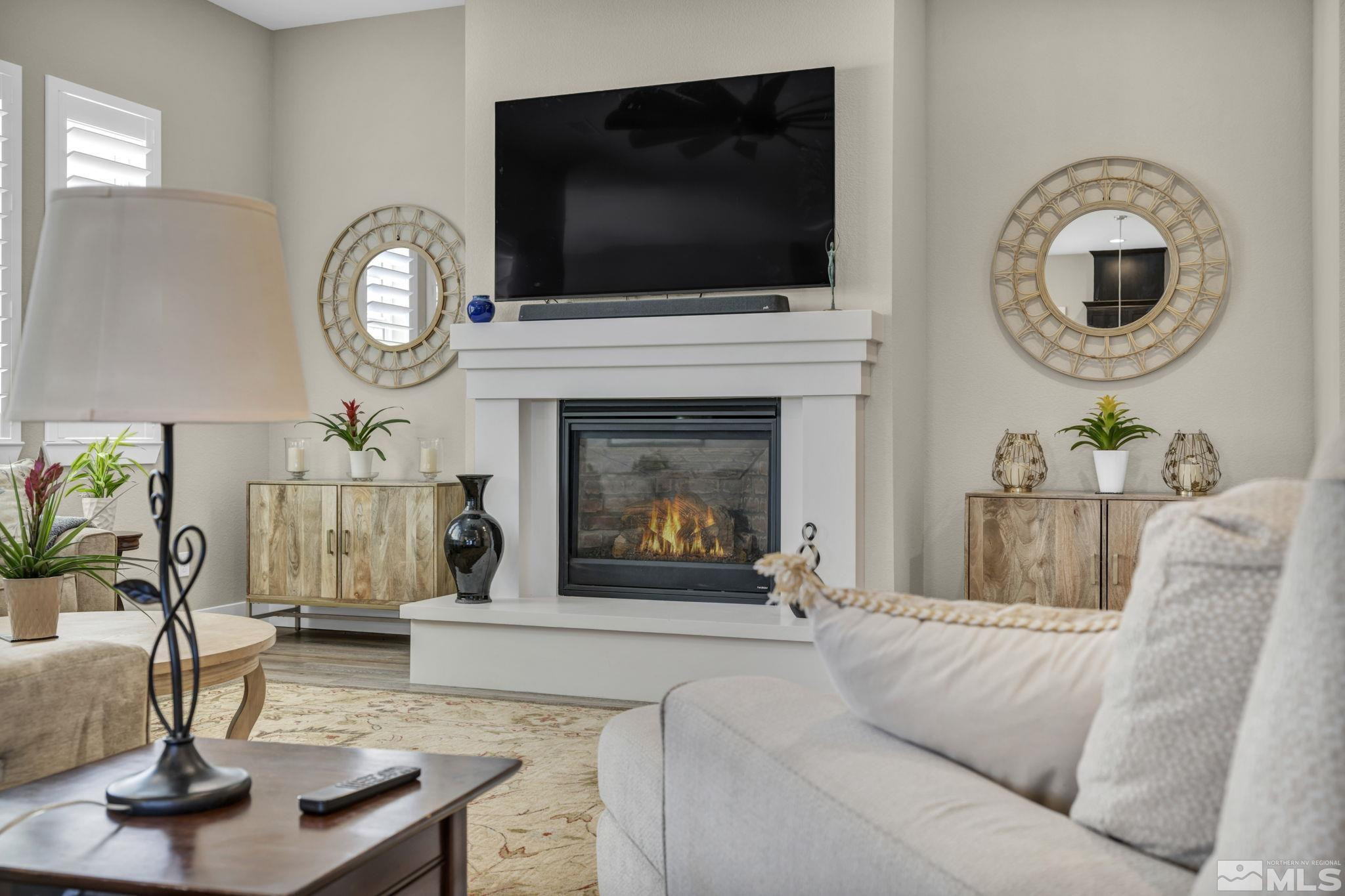 615 Sage Grouse Loop Stateline, NV 89449 - Photo 7 of 40 a living room with furniture a flat screen tv and a fireplace