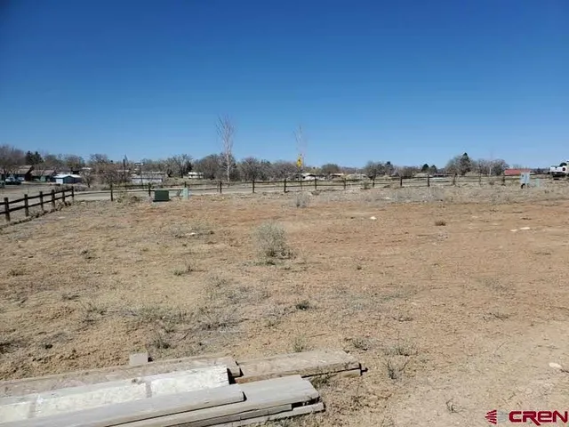 a view of a terrace with a wooden fence