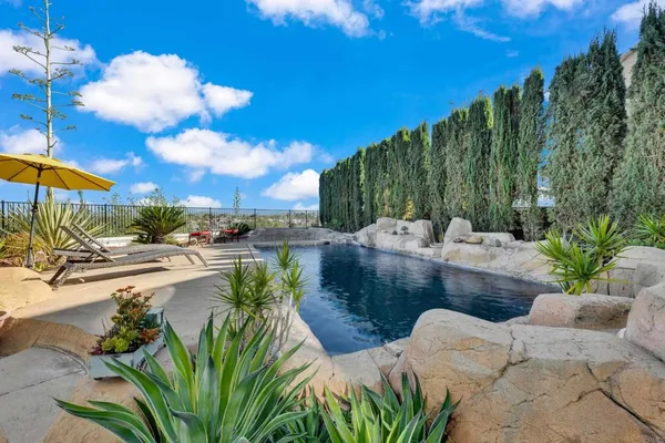 a view of a swimming pool with a patio