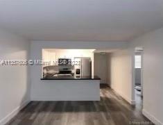 a view of a kitchen with a sink and dishwasher