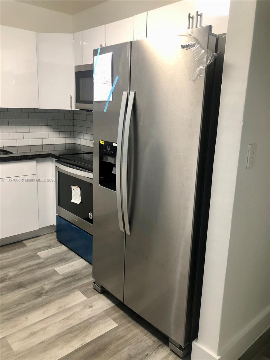Hialeah Hialeah, FL 33012 - Photo 3 of 7 a kitchen with stainless steel appliances a refrigerator and a stove