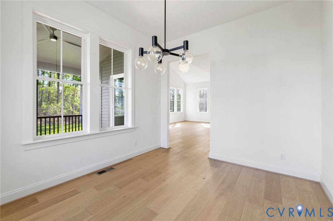 4624 Lake Summer Loop Moseley, VA 23120 - Photo 22 of 36 a view of an empty room with a window and wooden floor
