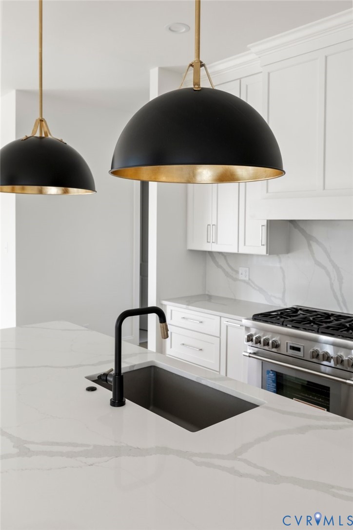 4624 Lake Summer Loop Moseley, VA 23120 - Photo 23 of 36 a kitchen with a sink and cabinets
