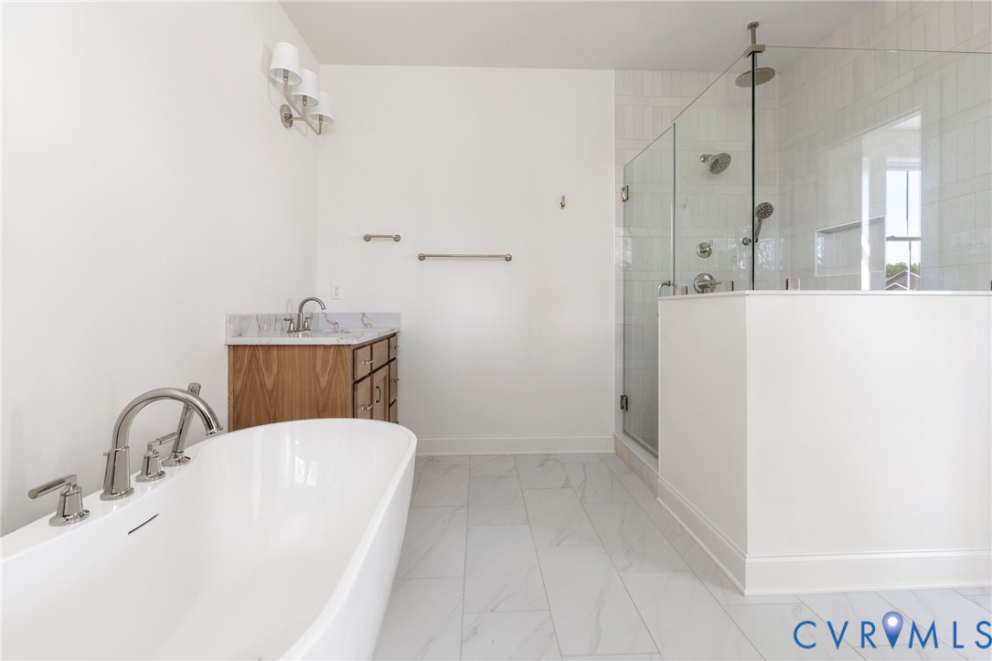 4624 Lake Summer Loop Moseley, VA 23120 - Photo 29 of 36 a bathroom with a sink a toilet and mirror