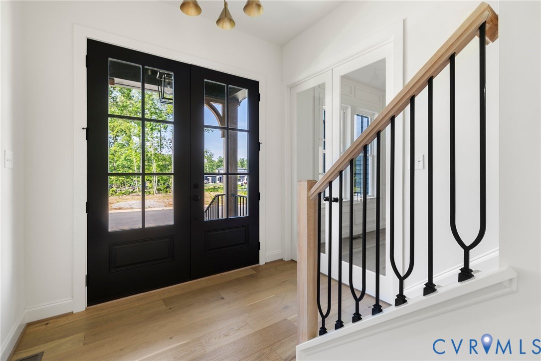 4624 Lake Summer Loop Moseley, VA 23120 - Photo 3 of 36 a view of staircase with wooden floor and a window
