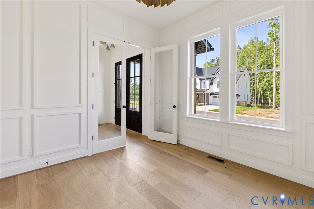 4624 Lake Summer Loop Moseley, VA 23120 - Photo 6 of 36 wooden floor in an empty room with a window