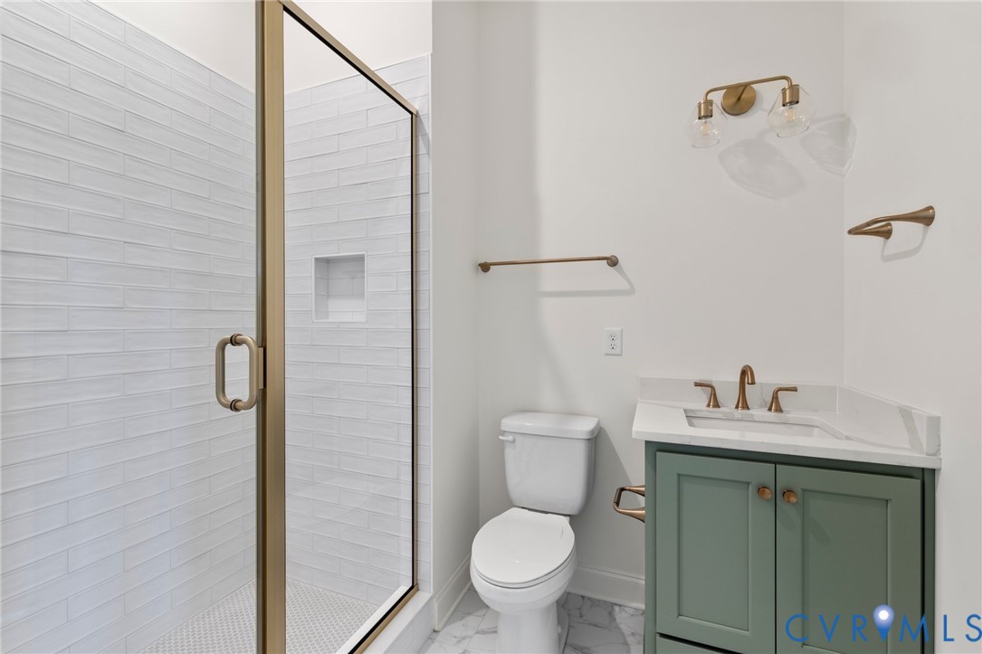 4624 Lake Summer Loop Moseley, VA 23120 - Photo 8 of 36 a bathroom with a sink toilet and shower