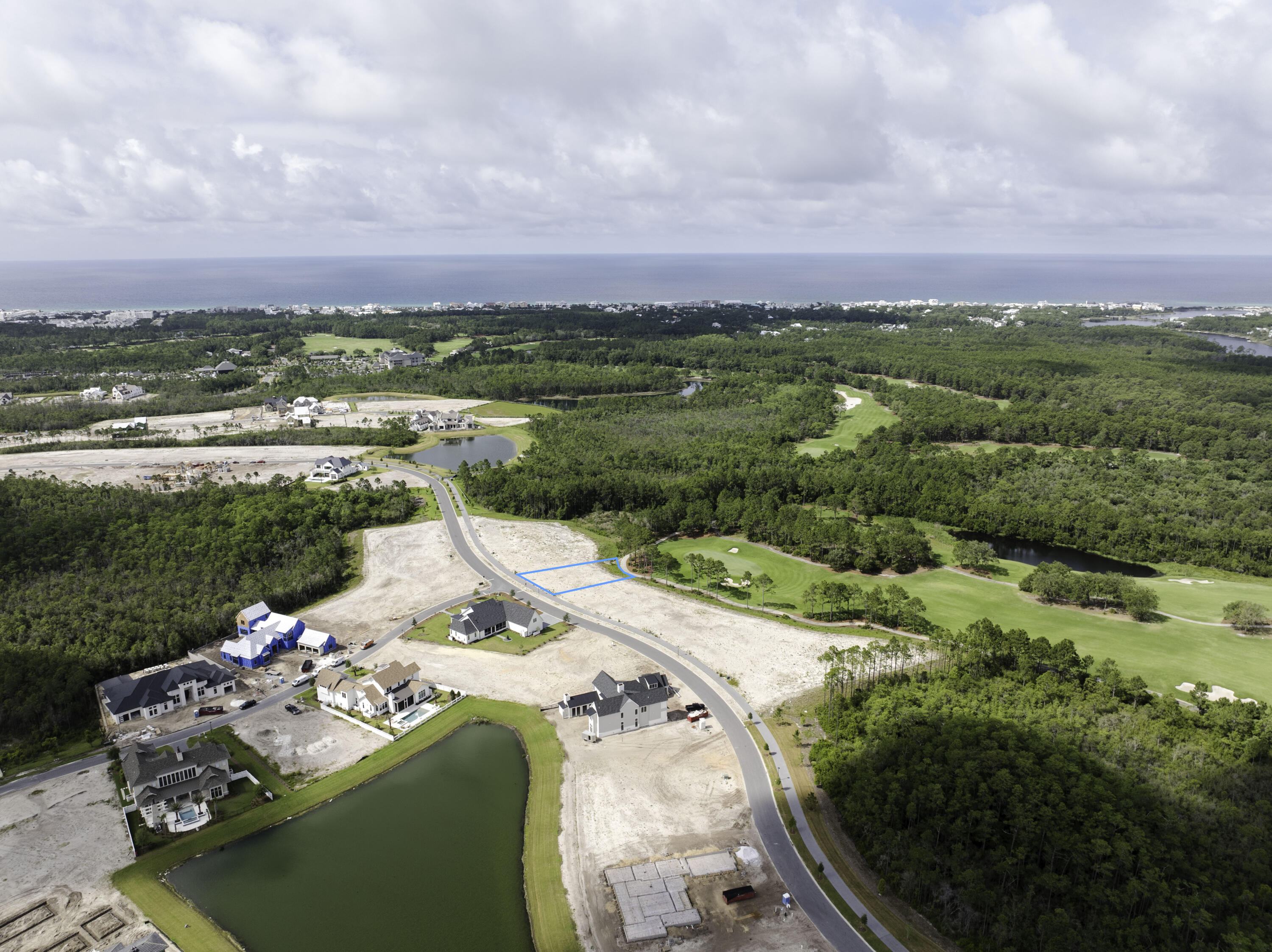 Lot 79 Windsong Dr Inlet Beach Inlet Beach, FL 32461 - Photo 8 of 8 a view of a lake with a building in the background