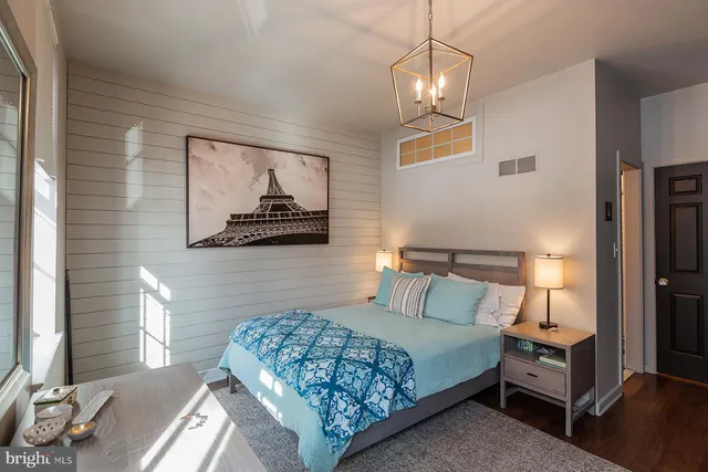 a bathroom with a sink vanity and a mirror