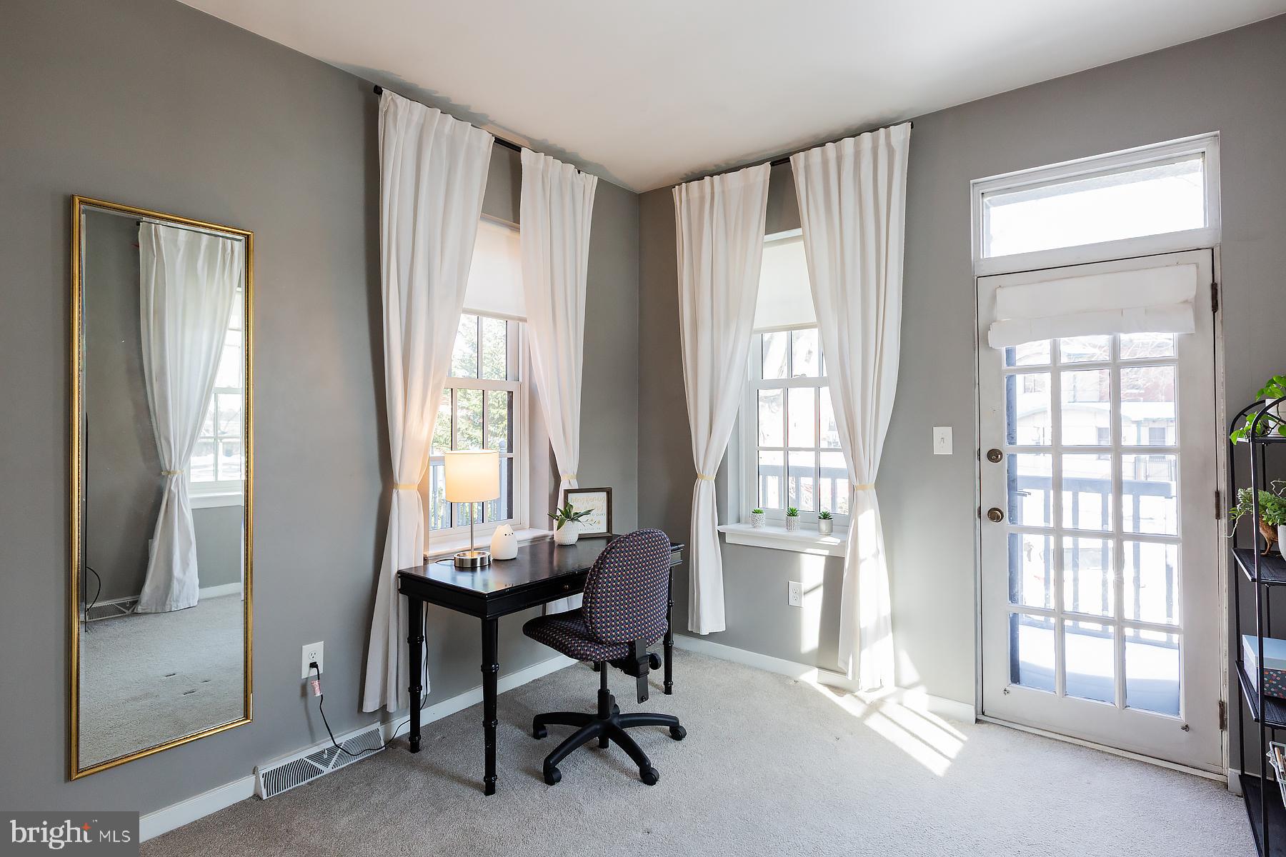 139 South Duke Street Lancaster, PA 17602 - Photo 30 of 43 a view of a livingroom with workspace and a window