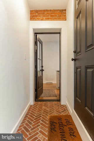 front view of a house with a tree