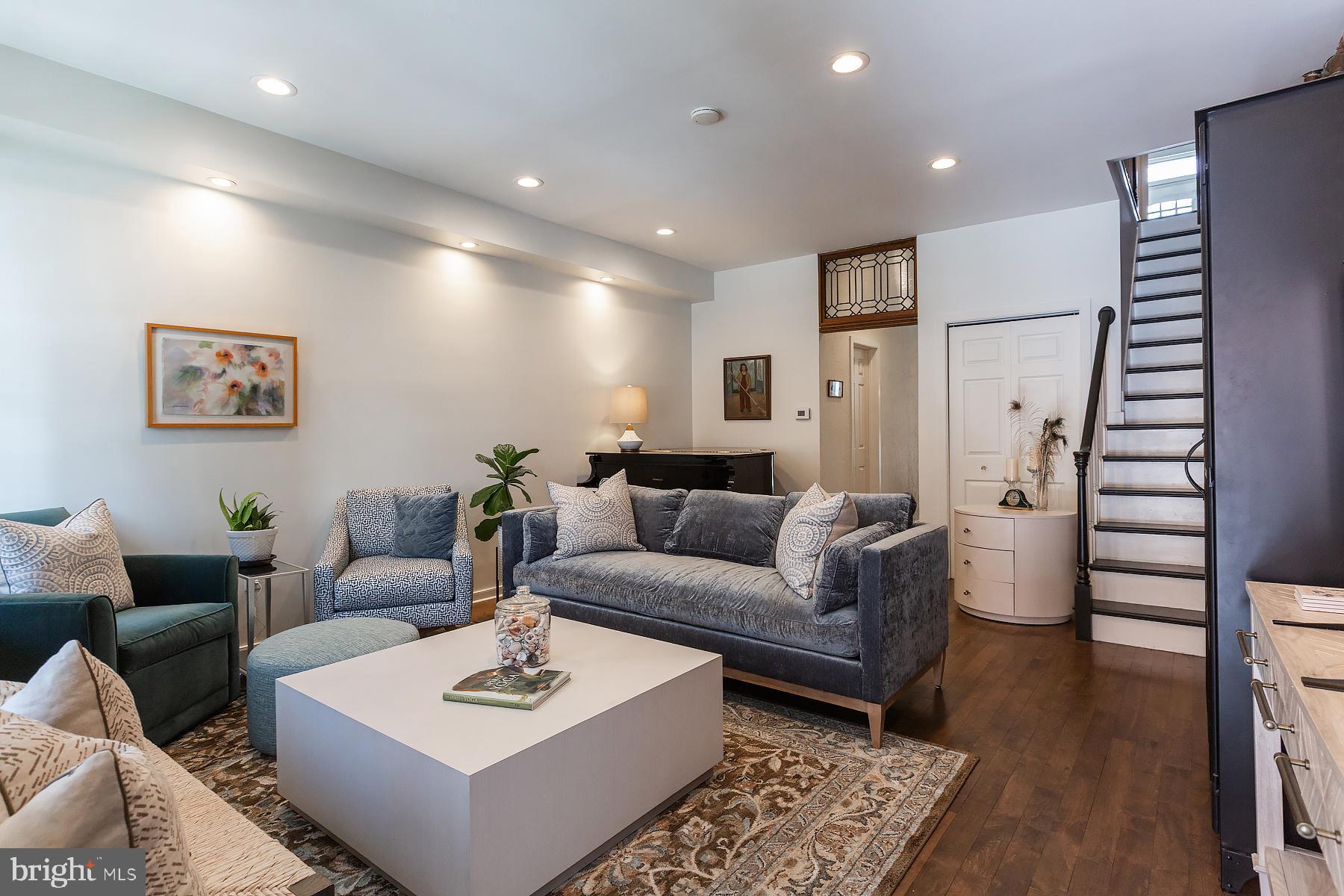 139 South Duke Street Lancaster, PA 17602 - Photo 8 of 43 a living room with furniture and wooden floor
