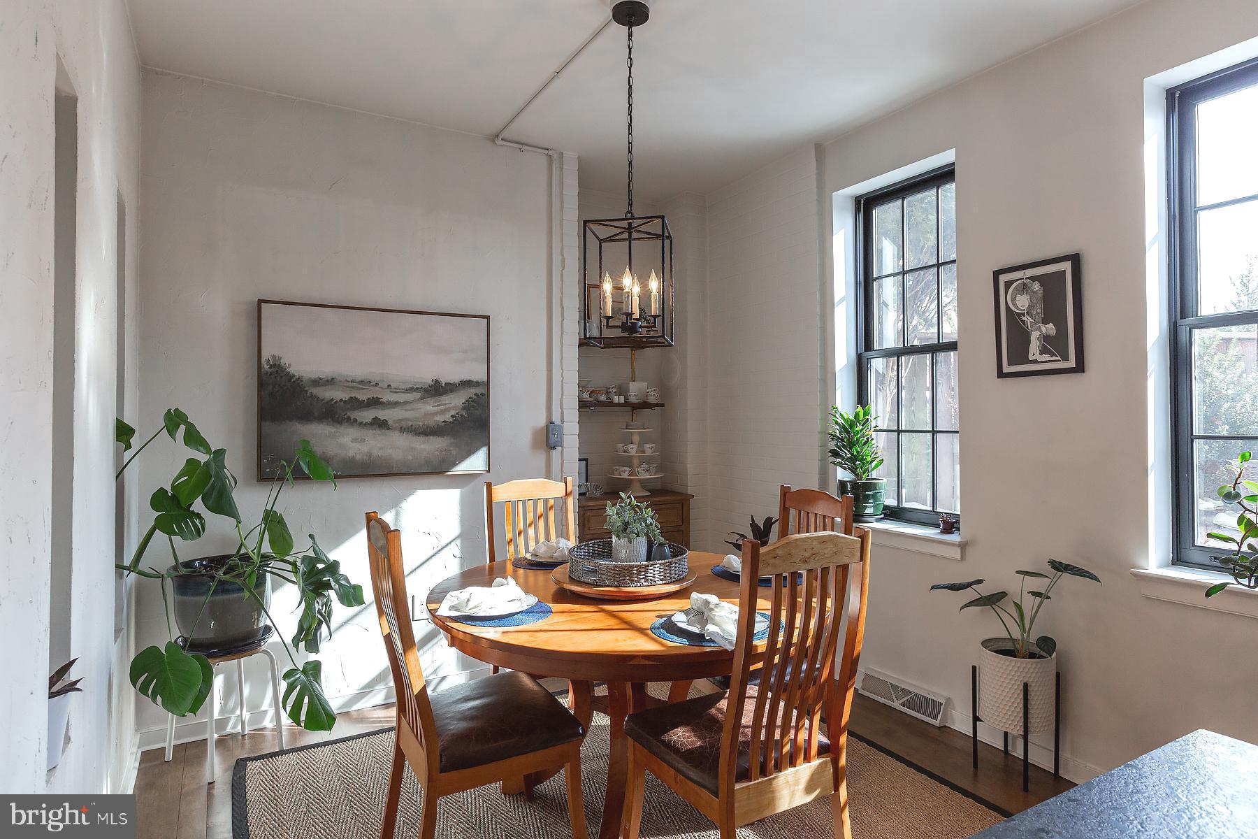 139 South Duke Street Lancaster, PA 17602 - Photo 10 of 43 a dining room with furniture potted plants and wooden floor
