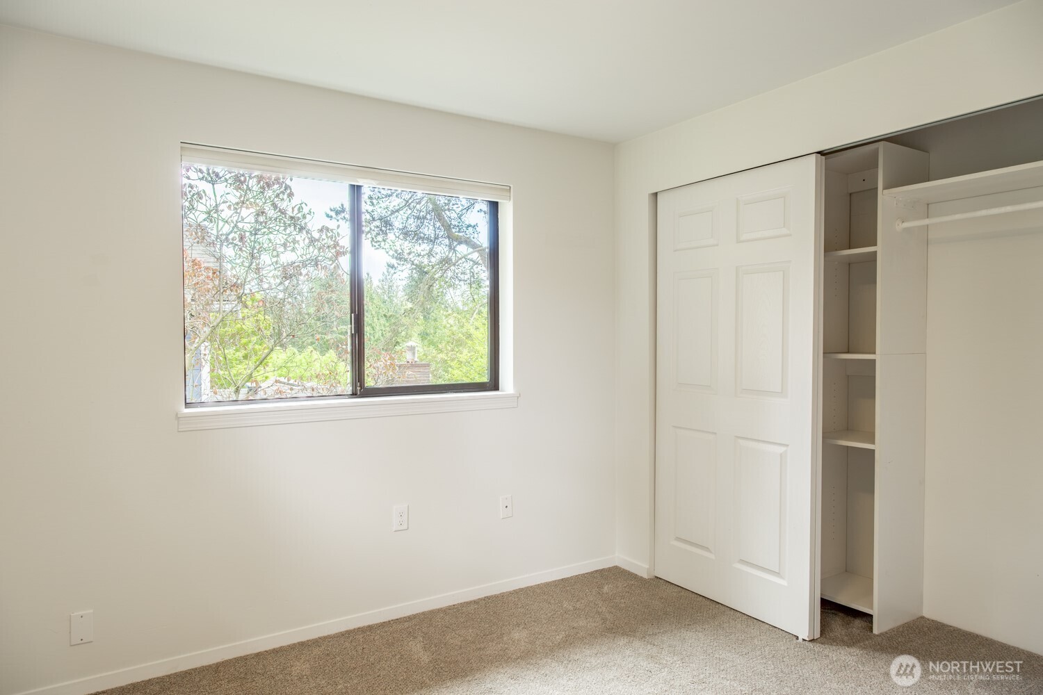 912 Northeast 115th Street Seattle, WA 98125 - Photo 18 of 21 a view of an empty room with a window