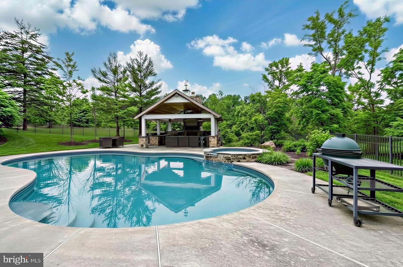 3165 Doe Brook Road Collegeville, PA 19426 - Photo 3 of 5 a view of a swimming pool with a lounge chairs